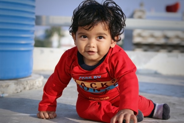 Young Indian boy eager to learn (2–3 years)